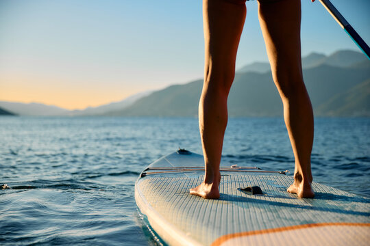 Woman from behind on SUP
