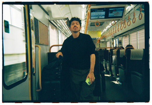 Man on Japanese Train in Osaka
