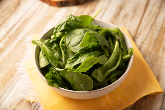 Baby spinach. Fresh and healthy green leaves, ready to eat raw or cooked, are a nutritious ingredient for salads and many vegetarian recipes.