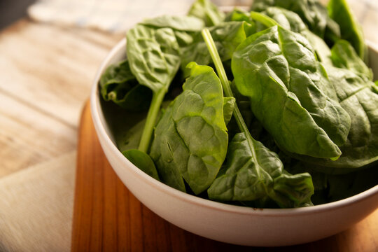 Baby spinach. Fresh and healthy green leaves, ready to eat raw or cooked, are a nutritious ingredient for salads and many vegetarian recipes.
