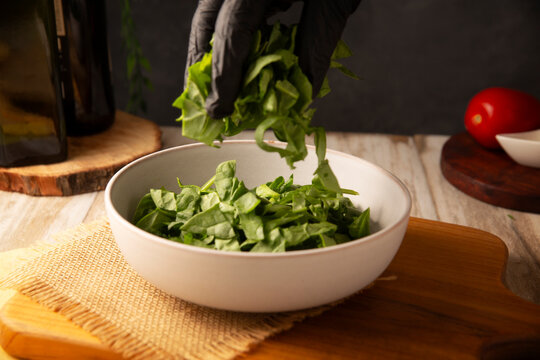 Baby spinach. Fresh and healthy green leaves, ready to eat raw or cooked, are a nutritious ingredient for salads and many vegetarian recipes.