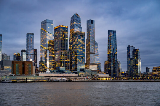 New York, USA, 2 March 2026: Panoramic skyline view of Hudson Yards during blue hour. Modern skyscrapers and waterfront architecture of Manhattan West Side from the river