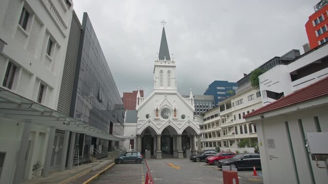 Historic Saint Andrews Cathedral in Singapore featuring elegant Gothic architecture colonial style and beautiful cityscape in a vibrant Asian travel destination