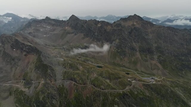 Scenic aerial landscape of the Tyrol Alps around Timmelsjoch with towering rocky mountain peaks on the Austria Italy border inspiring adventure travel and tourism in Europe