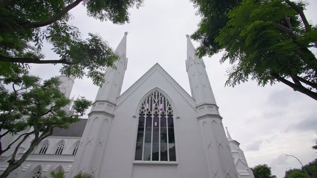 Beautiful Saint Andrews Cathedral with historic Anglican architecture creating an iconic landmark in the modern Singapore city skyline and tourism in Asia 