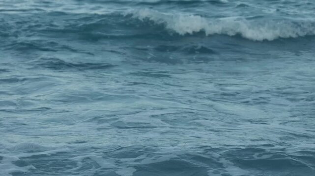 Powerful waves crashing onto a sandy beach