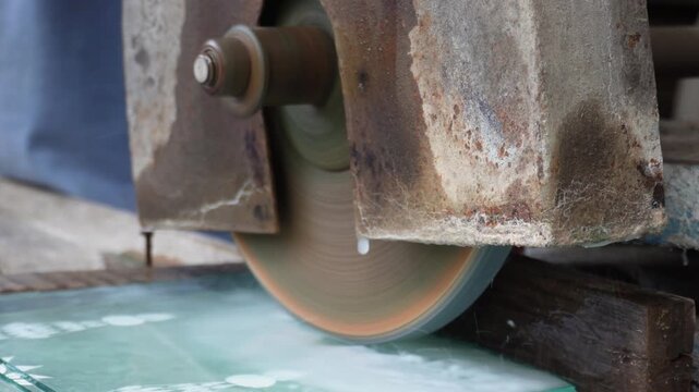 Wet saw cutting glass with precision