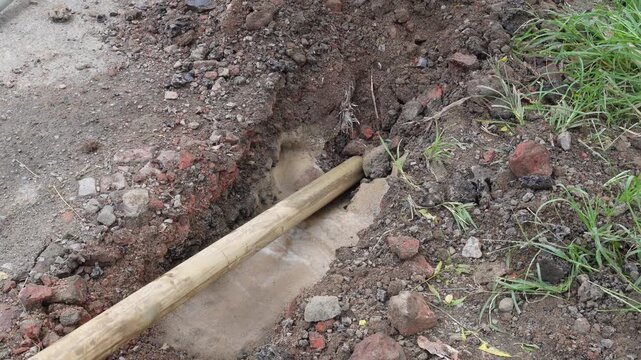 Underground utility pipe exposed during excavation work