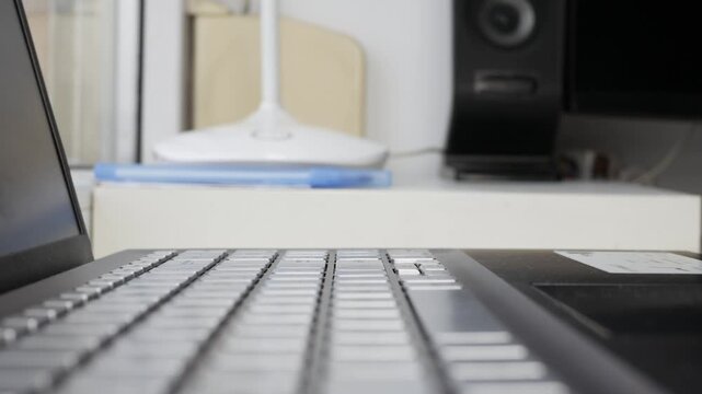 Finger Pressing Laptop Keyboard Key Closeup. Hand Typing on Laptop Keyboard Closeup Detail