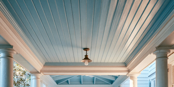 Classic porch ceiling with hanging lantern light, daytime