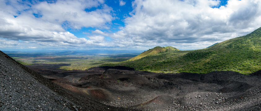 Panoramic view from the active Cerro Negro volcano overlooking the lush green hills of the Maribios mountain range and vast plains in Leon, Nicaragua