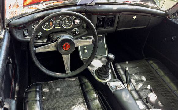 TAVERNES BLANQUES, SPAIN - JUNE 14, 2026.Interior view of a classic British MG MGB roadster cockpit with vintage dashboard and gear shifter at a car show