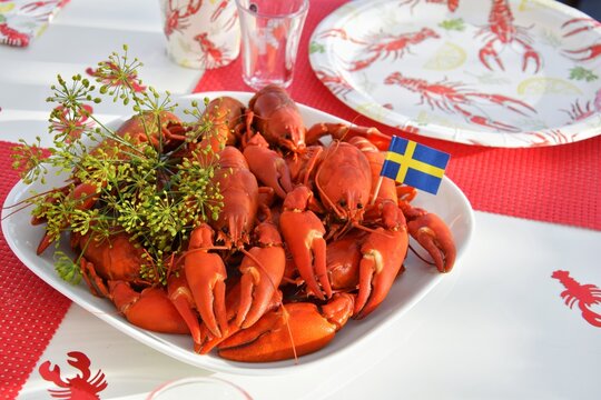 Crayfish parties in Sweden.On the plate are crayfish boiled in beer with dill