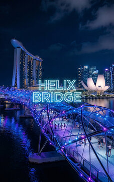 Night View of Illuminated Helix Bridge and Marina Bay, Singapore
