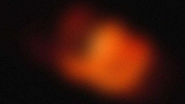 Abstract orange light glow on dark black background