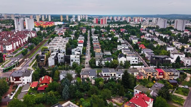 City Residential Buildings Streets Green Trees Park Landscape Horizon. A high angle drone shot capturing a contemporary urban neighborhood with diverse housing architecture