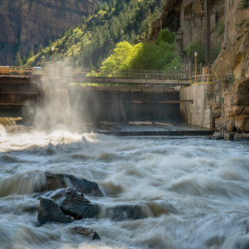 Colorado River flowing from an open gate of Shoshone Power Plant in Glenwood Canyon