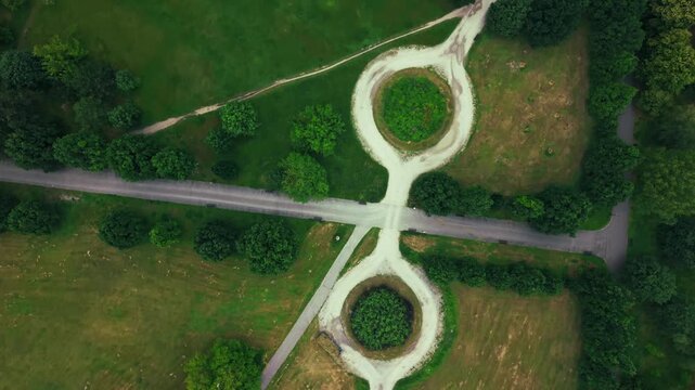 Park Paths Green Grass Lawn Trees Roundabout. Aerial Top View. Crisp drone perspective looking straight down at a well-maintained urban public park