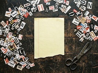 Ransom Note Mockup Top View with Two Blank Lined Yellow Papers Newspaper Cutout Letters Vintage Key and Scissors © Md Limon islam