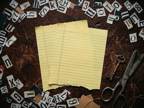 Ransom Note Mockup Top View with Two Blank Lined Yellow Papers Newspaper Cutout Letters Vintage Key and Scissors