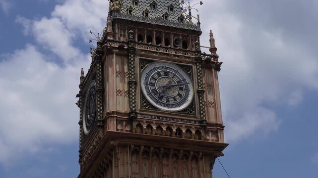 Big ben tower glowing over london skyline
