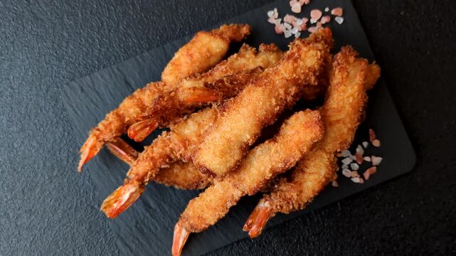 Shrimp or prawn tempura breaded with salt, spices and white tartar sauce, Asian cuisine. Tempura shrimp as a food background for your design
