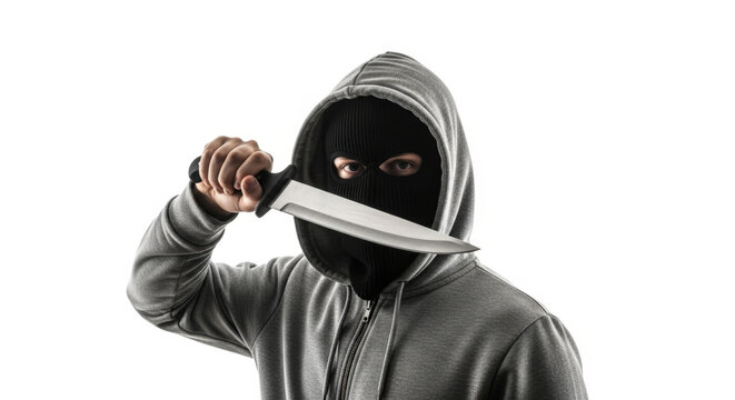 Dangerous hooded criminal brandishing sharp knife to threat and assault. Symbol of violence, aggression and danger