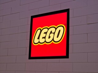 Fototapeta premium Illuminated LEGO Store Sign Mounted on a Brick-Patterned Wall on July 18 2026 in Bangkok, Thailand.