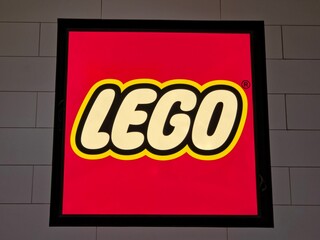 Fototapeta premium Close-up of an Illuminated LEGO Brand Logo Sign Mounted on a Wall on July 18 2026 in Bangkok, Thailand.