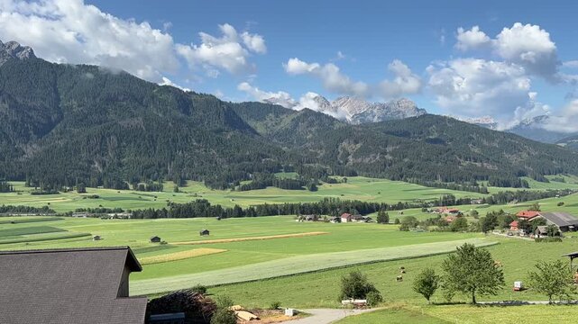 Time-lapse of dramatic clouds drifting over the breathtaking alpine landscape of the Puster Valley (Val Pusteria), South Tyrol, Italy, showcasing the ever-changing beauty of the Dolomites 