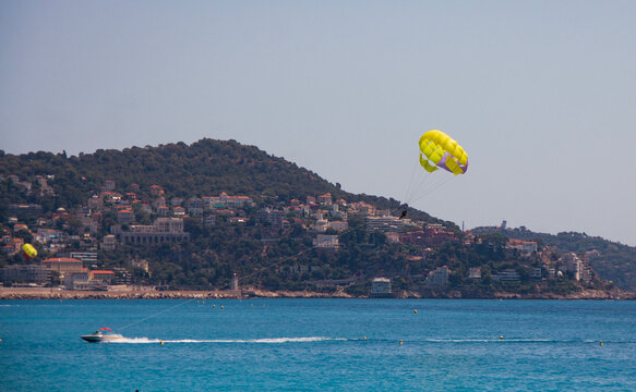 parasailing or water sports on the beach in Nice