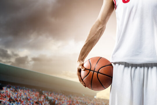 Basketball. Close-up of professional basketball players against the backdrop of the court. Sports close-up. Confidence in victory.