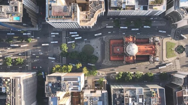 Rio de Janeiro in sunrise, Brazil. City center. Aerial view, establishing shot. Get&uacute;lio Vargas Avenue. Candelaria church
