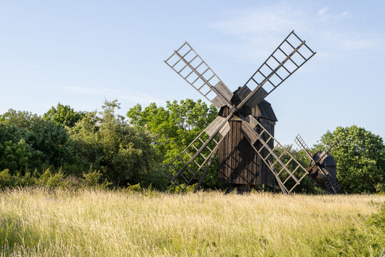 Historic Lerkaka wooden post mills on a grassy meadow of Oland island Sweden