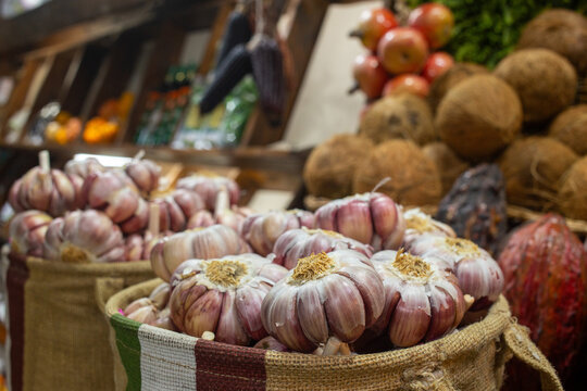 Closeup of a garlic basket in the public market