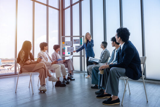 Successful happy workers Group of business people with Multiethnic workers with in company workers Group of asian business people and support Teamwork in the meeting room at modern office.
