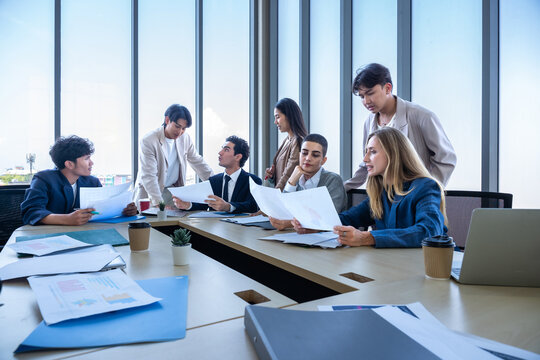 Successful happy workers Group of business people with Multiethnic workers with in company workers Group of asian business people and support Teamwork in the meeting room at modern office.