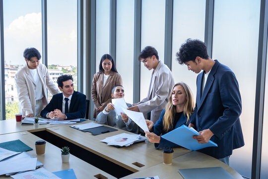 Successful happy workers Group of business people with Multiethnic workers with in company workers Group of asian business people and support Teamwork in the meeting room at modern office.