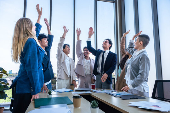 Successful happy workers Group of business people with Multiethnic workers with in company workers Group of asian business people and support Teamwork in the meeting room at modern office.
