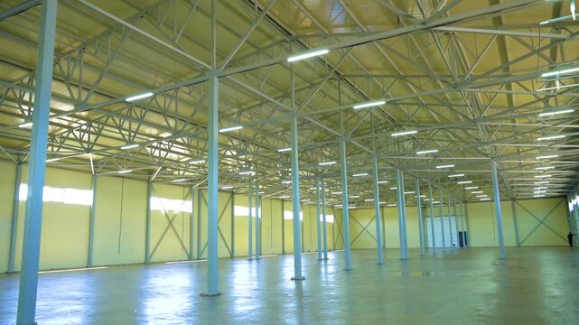 Spacious Empty Warehouse Interior With Steel Columns and High Ceiling