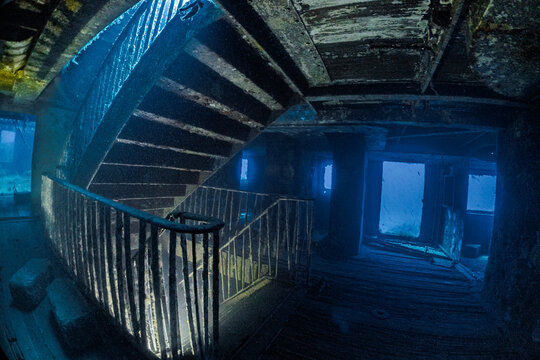 Interior view of the famous staircase inside the MV Karwela shipwreck near Gozo, Malta. The intentionally scuttled wreck is one of the Mediterranean's most iconic scuba diving sites