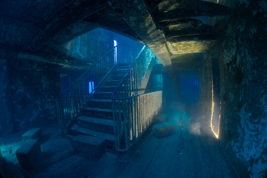 Interior view of the famous staircase inside the MV Karwela shipwreck near Gozo, Malta. The intentionally scuttled wreck is one of the Mediterranean's most iconic scuba diving sites