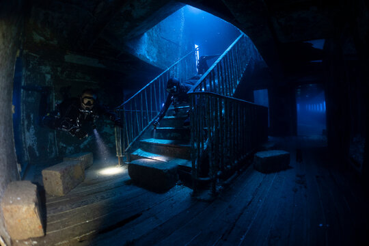 Interior view of the famous staircase inside the MV Karwela shipwreck near Gozo, Malta. The intentionally scuttled wreck is one of the Mediterranean's most iconic scuba diving sites