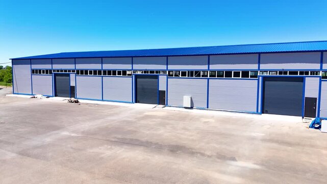 Modern Warehouse Buildings with Logistics Yard and Loading Area Between Industrial Facilities