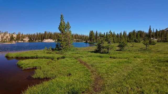 Cathedral Peak rises above Upper Cathedral Lake in Yosemite