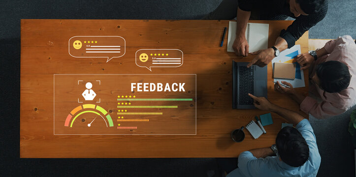 A dynamic team collaborates in a modern workspace, utilizing digital feedback tools and interactive ratings, fostering innovation and communication effectively. Trope