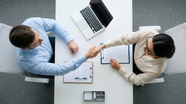 Business job recruitment process with a handshake between HR and candidate.
