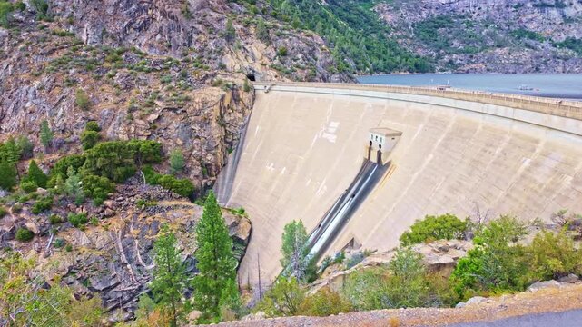 Panoramic view captures Hetch Hetchy Dam and the surrounding valley in Yosemite
