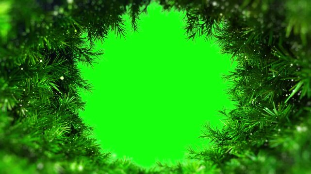 Christmas pine branch decorative frame with twinkling glitter on green screen background