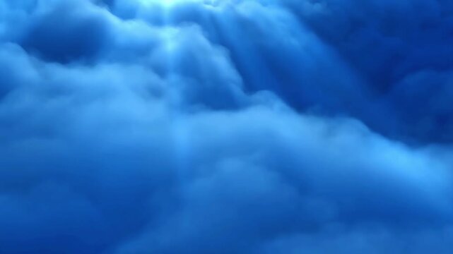 Sunbeams breaking through dramatic blue clouds in the sky.